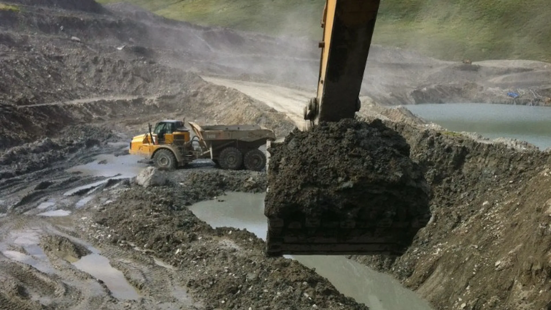 Loaded haul truck in an Alaska open-pit mine from the cab